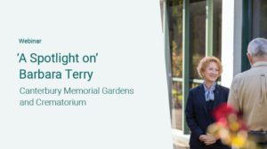 Webinar titled 'A Spotlight on Barbara Terry: Canterbury Memorial Gardens and Crematorium.' The image shows Barbara Terry, a woman with short red hair wearing a dark blazer, smiling while standing outdoors and speaking to an older man.